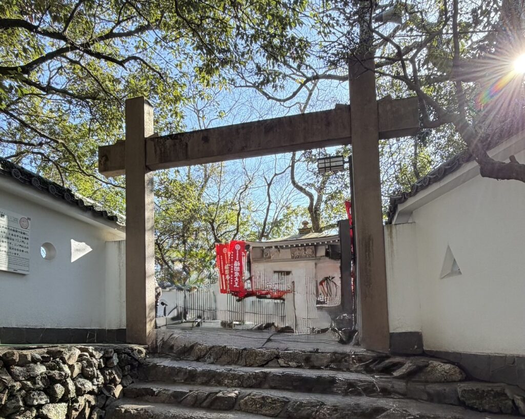 The concrete 'Second Bailey Gate' on the upper slope of Mount Kinka, a waypoint on the summit walking trail