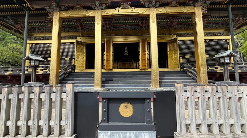 Ueno Toshogu Shrine Kinshikiden Special Door Opening — a full frontal view with the doors open. The contrast between black and gold makes the shrine building stand out.
