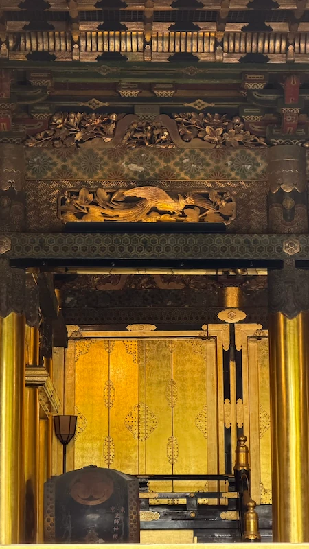 Interior of Ueno Toshogu Shrine’s Kinshikiden. Phoenix carvings and the golden inner sanctuary are visible.