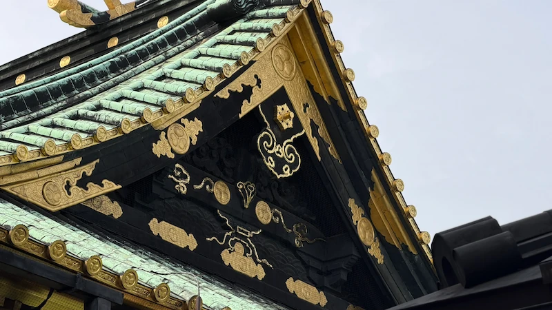 Roof of Ueno Toshogu Shrine’s Kinshikiden. Gold patterns on black and the verdigris of copper roofing.