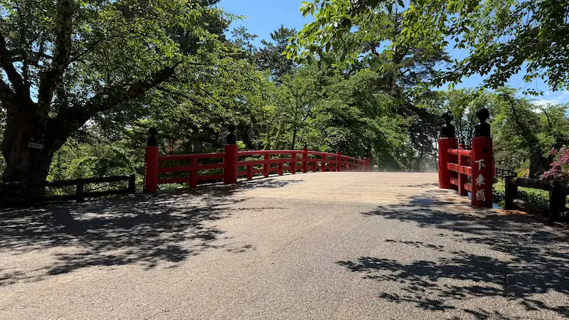 Gejo-bashi Bridge with Hirosaki Castle keep (May 2026)