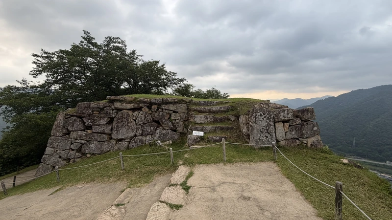 A stone wall and steps around Take-no-mon Gate Site.