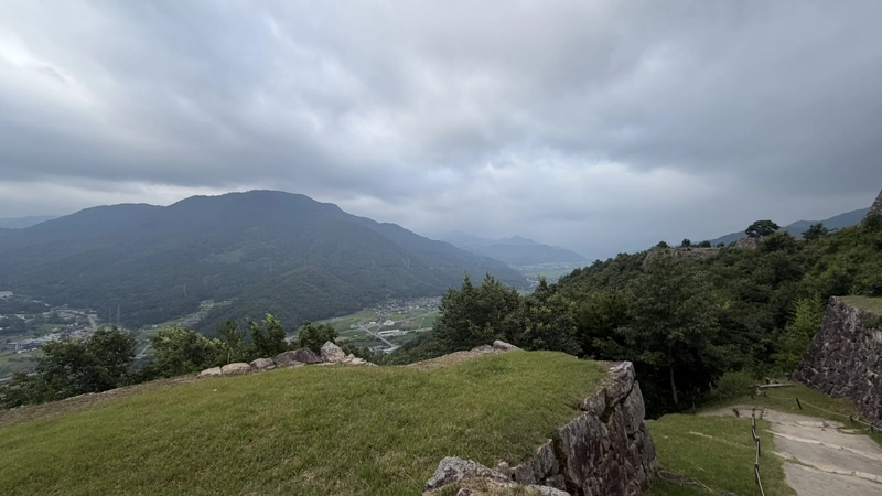 View of mountains and a valley from around Mitsuke Turret Site. The castle grounds are high up, with a wide view.