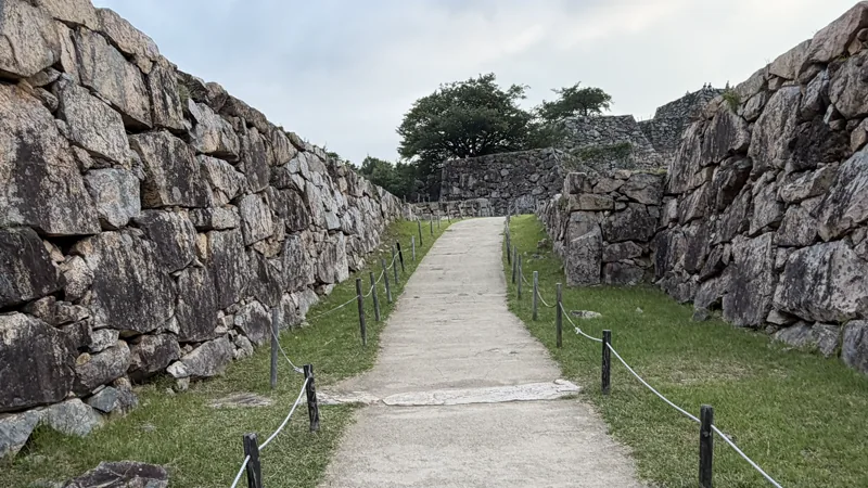 Stone walls around Main Gate Site at Takeda Castle Ruins