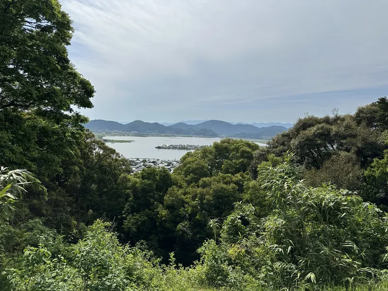 A view toward the Lake Biwa area through the trees near Sōken-ji's former main hall site.