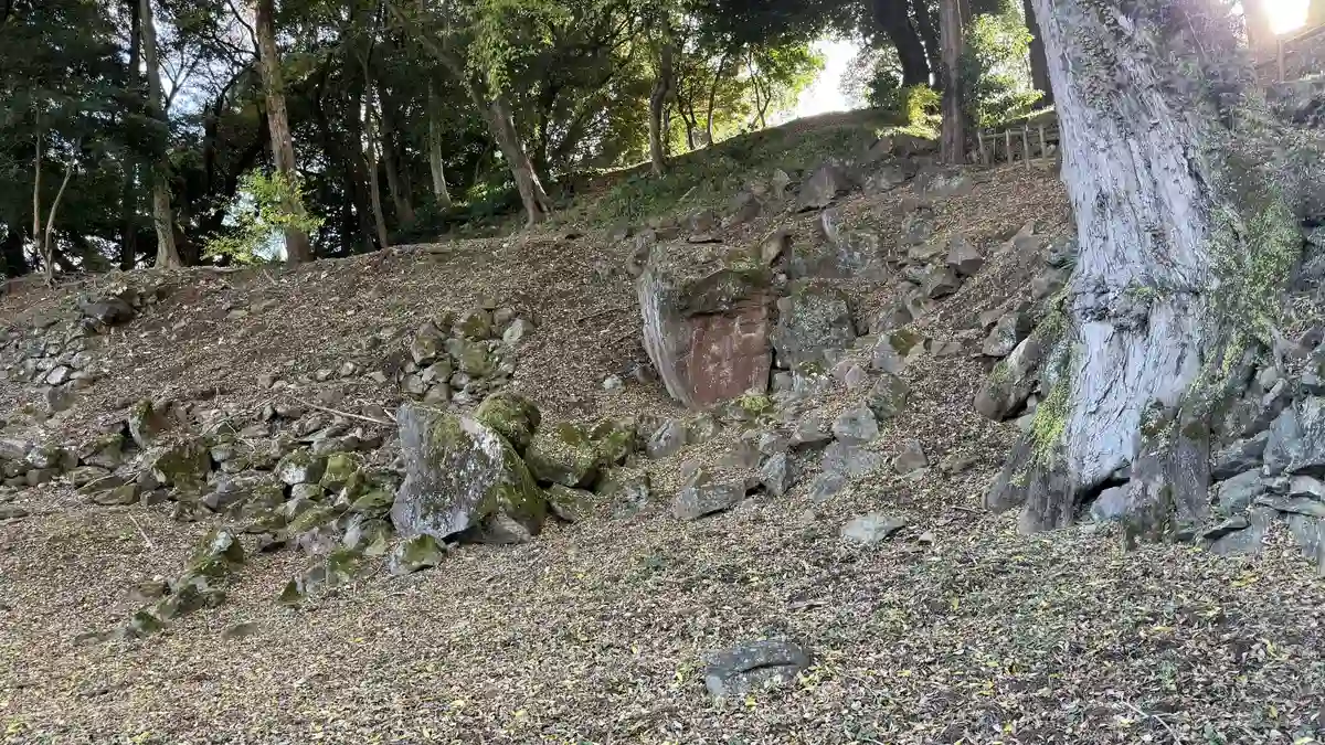 Dry-stacked stone walls surrounding the well enclosure