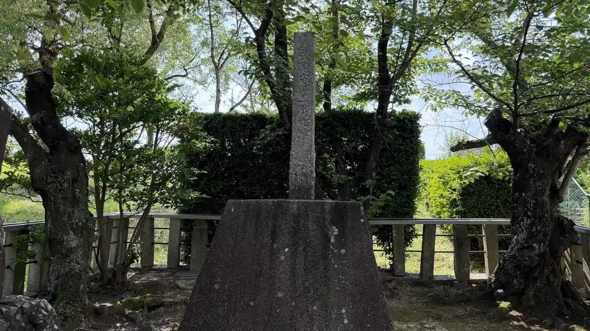 Stone monument of Musashizuka standing among trees