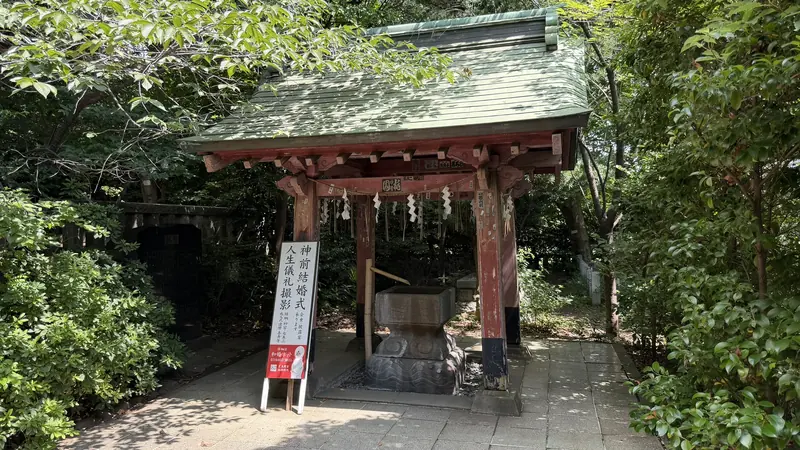 Purification pavilion with a red roof at Shiba Toshogu