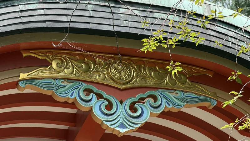 Colored carvings on the curved gable of Shiba Toshogu's worship hall