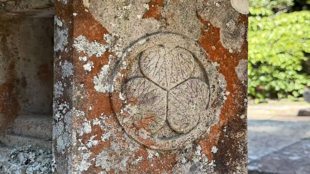 The triple hollyhock crest of the Tokugawa family carved into a stone lantern at Kunozan Toshogu
