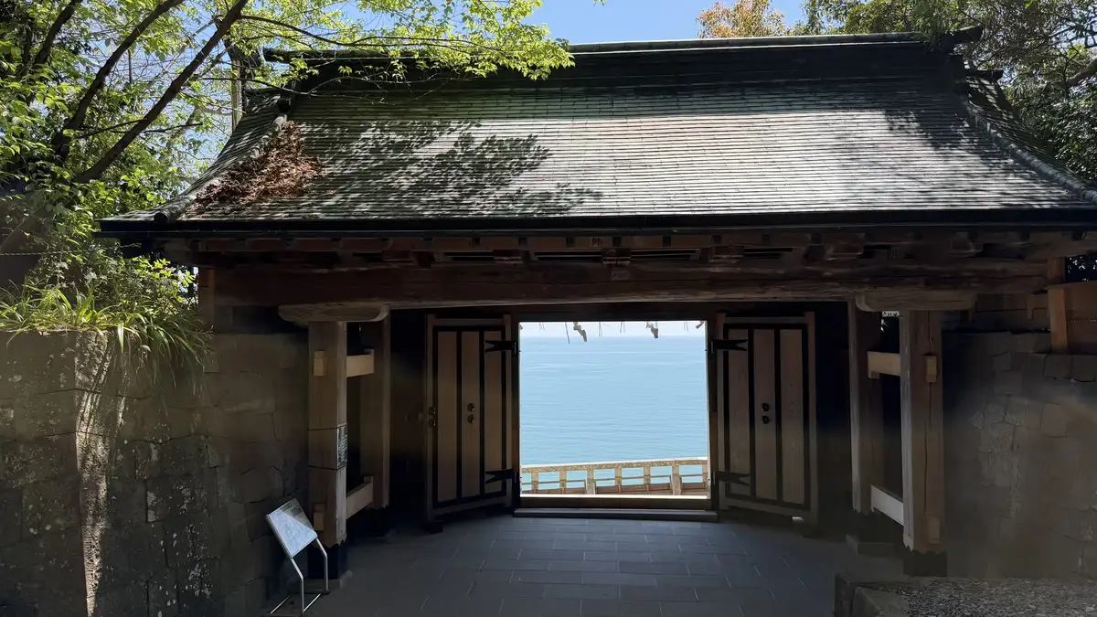 Suruga Bay framed by the opening of the Ichinomon gate on the upper stone stairway at Kunozan
