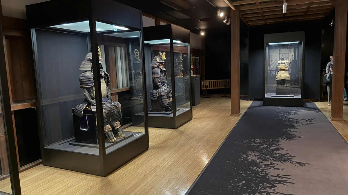 Suits of armor in glass cases in the SAMURAI Museum