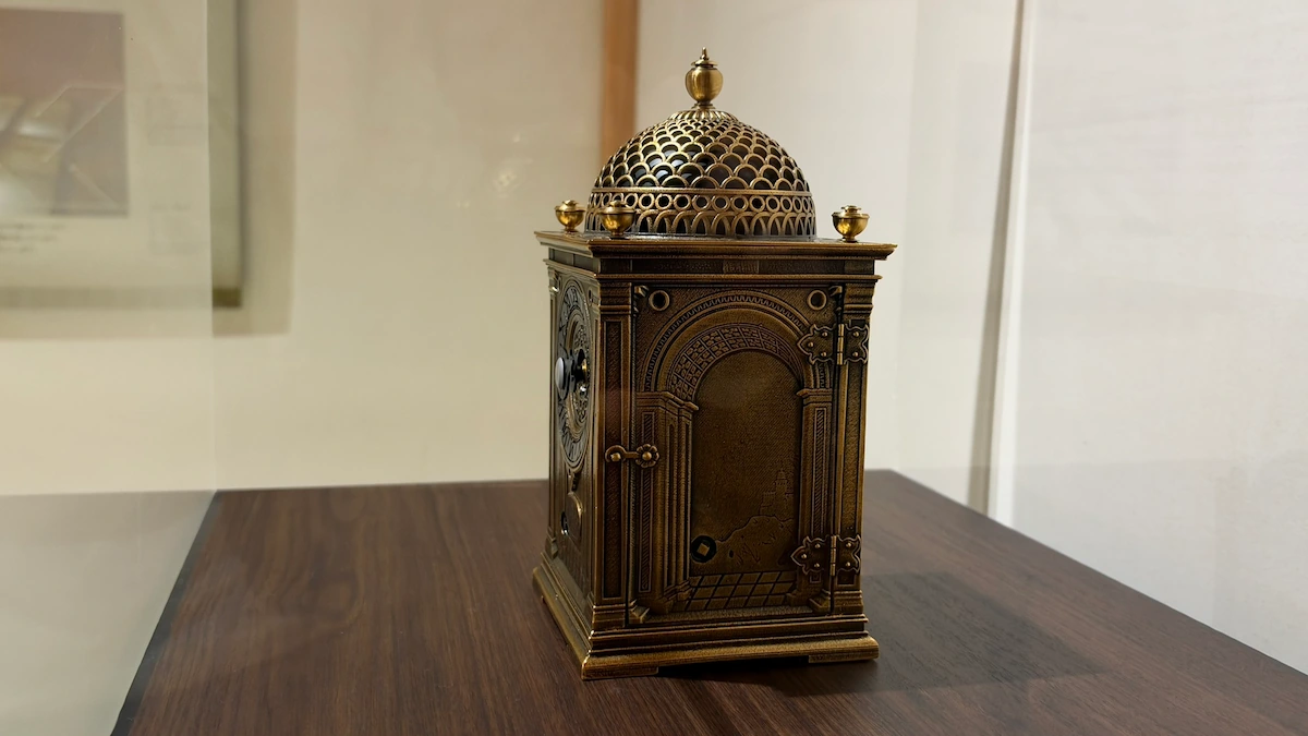 Reproduction of a table clock in Hitsujisaru Turret, Sunpu Castle Park, seen from the side, showing the domed roof and an arched, door-like panel