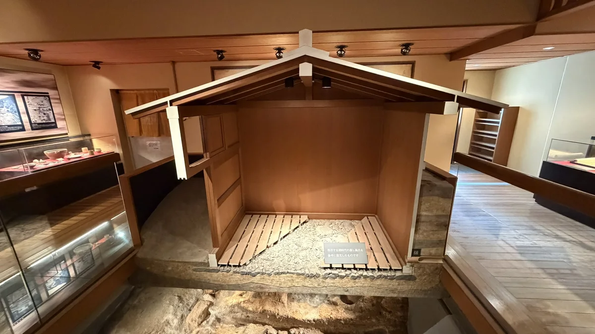 Reconstructed model of the steam bath, a wooden model set over the excavated remains.